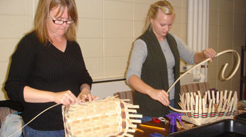 Two Women Weaving Baskets at a Community Education Class at the Heider Center